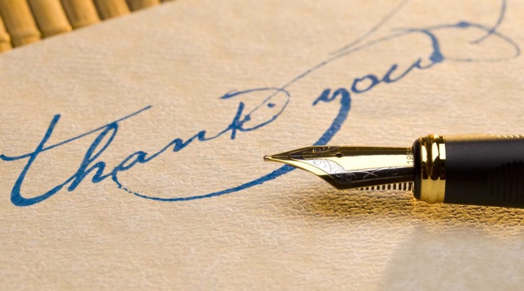 "Thank you" written in blue ink cursive