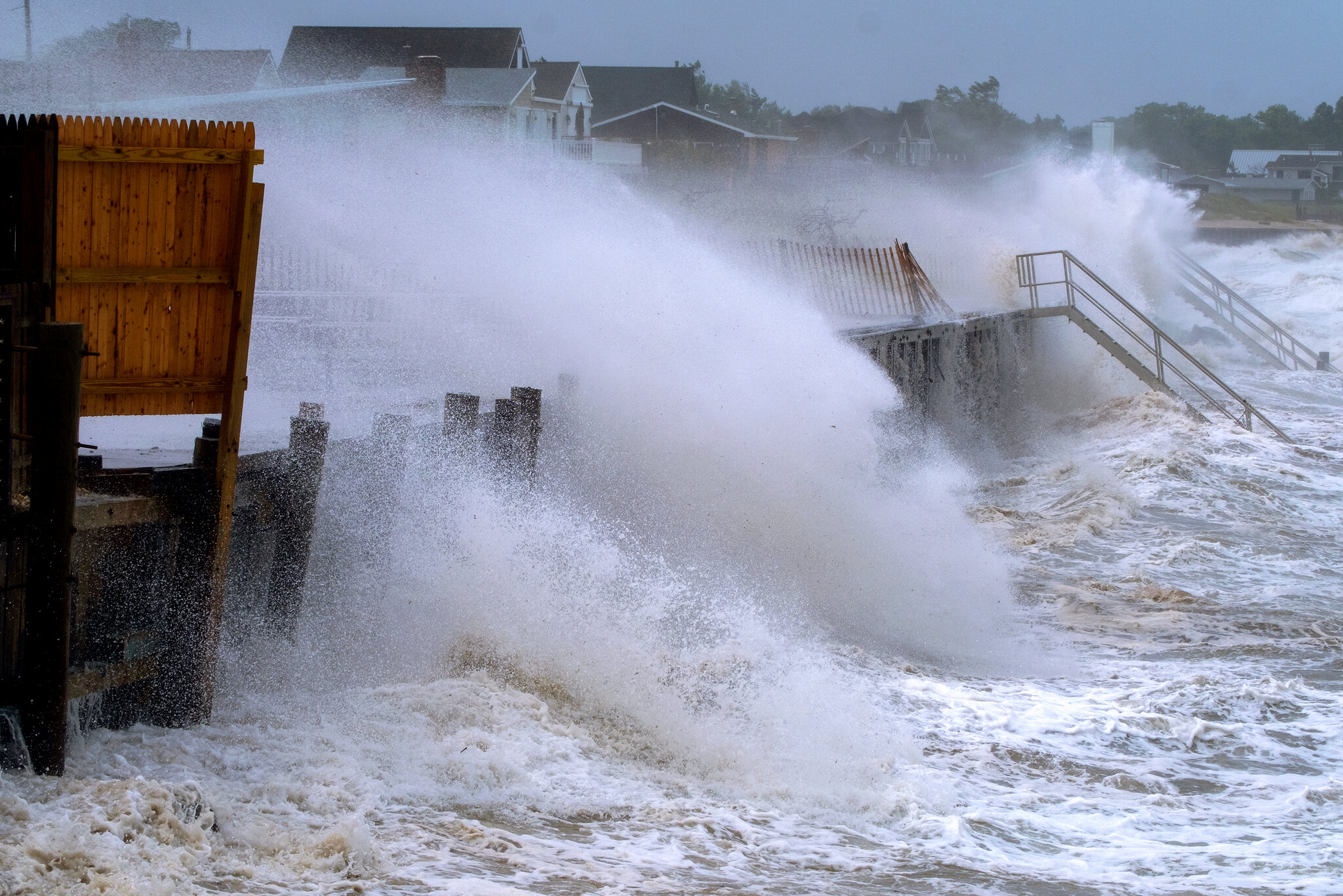 Waves crashing into a dock on the Hamptons