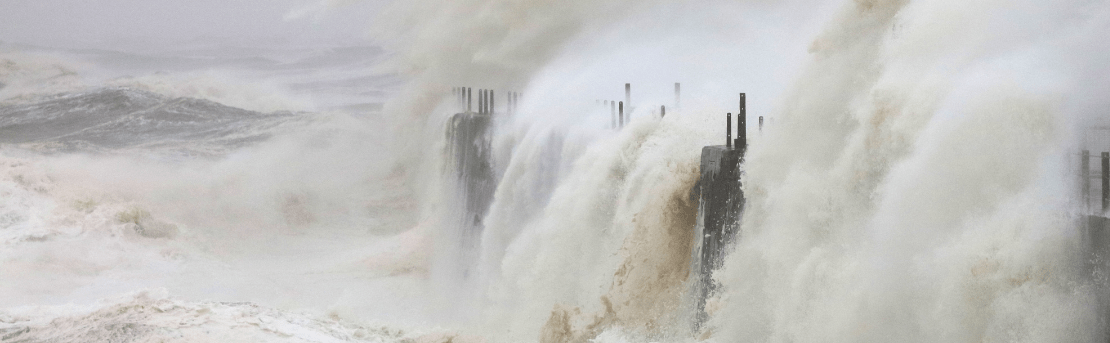 Waves crashing into a dock