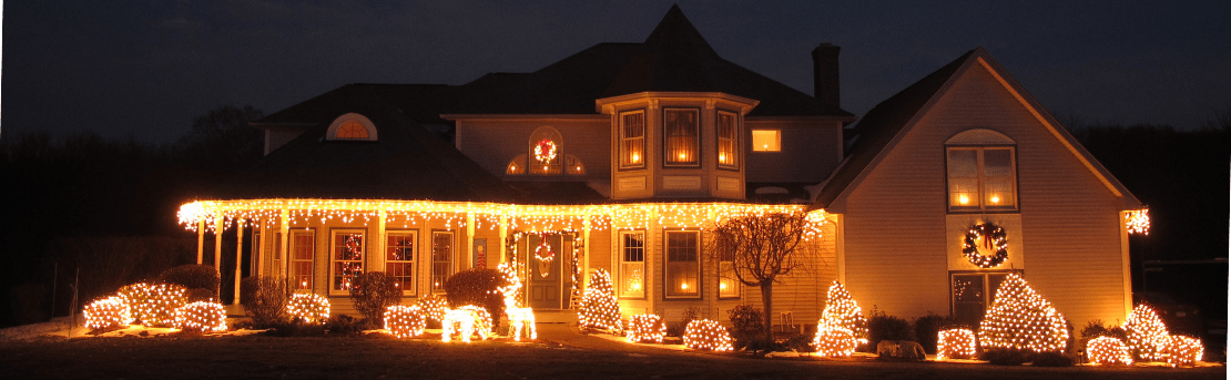 House at night decorated with Christmas lights