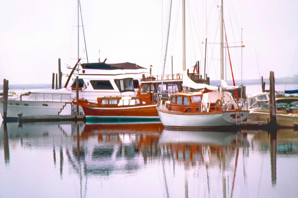 three boats docked in the Hamptons
