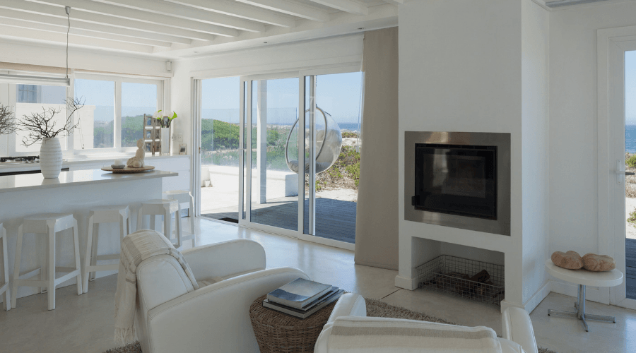Open concept living room with a beachfront view