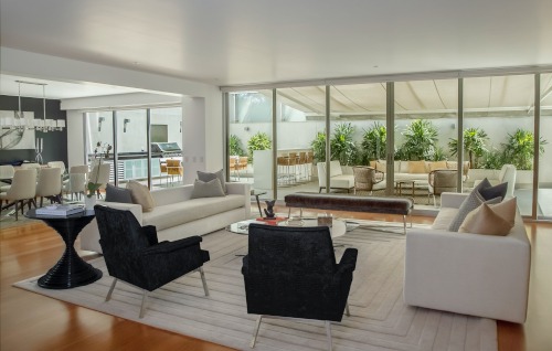 open concept living room with a balcony