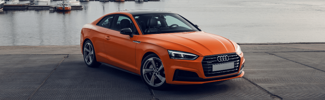 Audi parked in front of a dock
