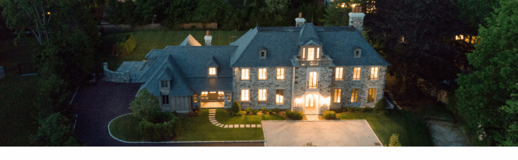 Aerial shot of coastline property at night.